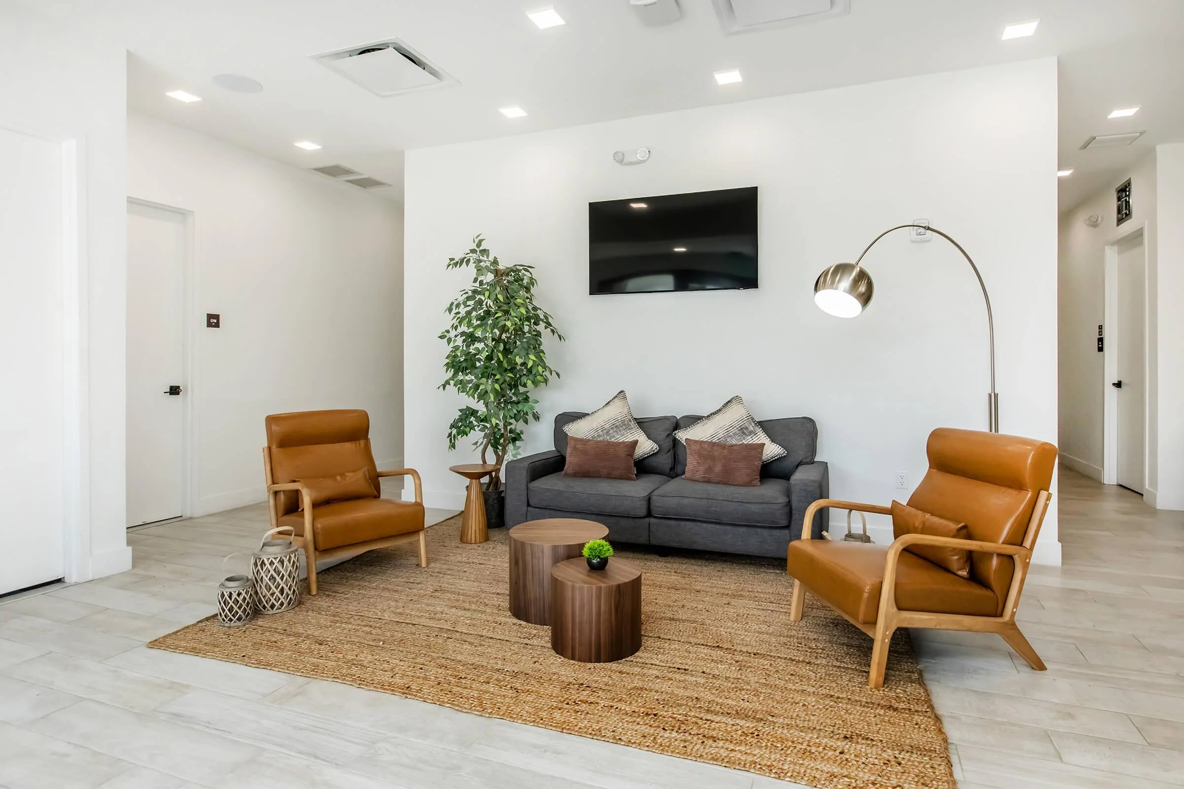 Modern Towers lounge with sofa, armchairs and coffee table.